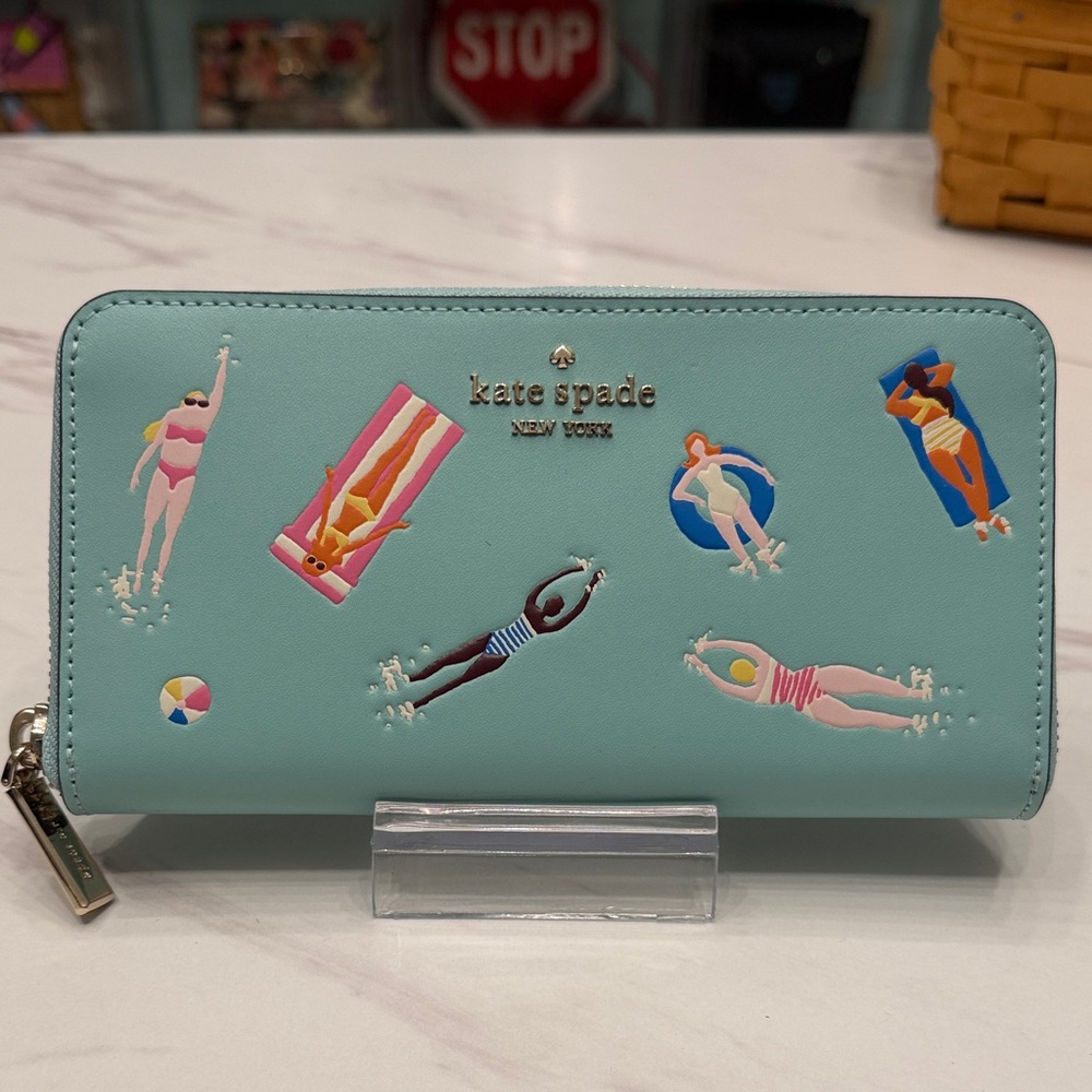 kate spade aqua zip-around wallet with swimmers print